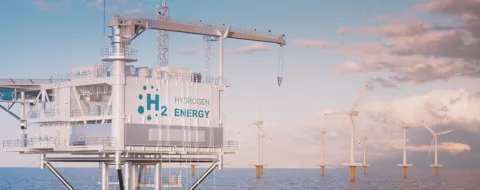 Close up view of offshore hydrogen production through a hydrogen rig platform with an offshore wind turbine farm  - in the middle of the sea