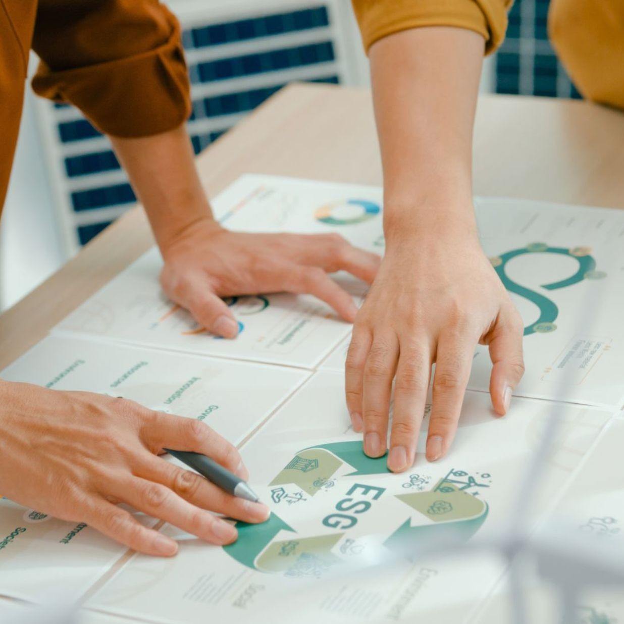 Closeup of team members examine ESG-related documents