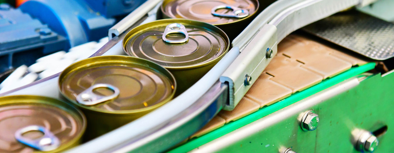 canned food product on conveyor belt