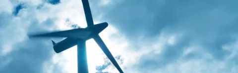 wind turbine and storm clouds